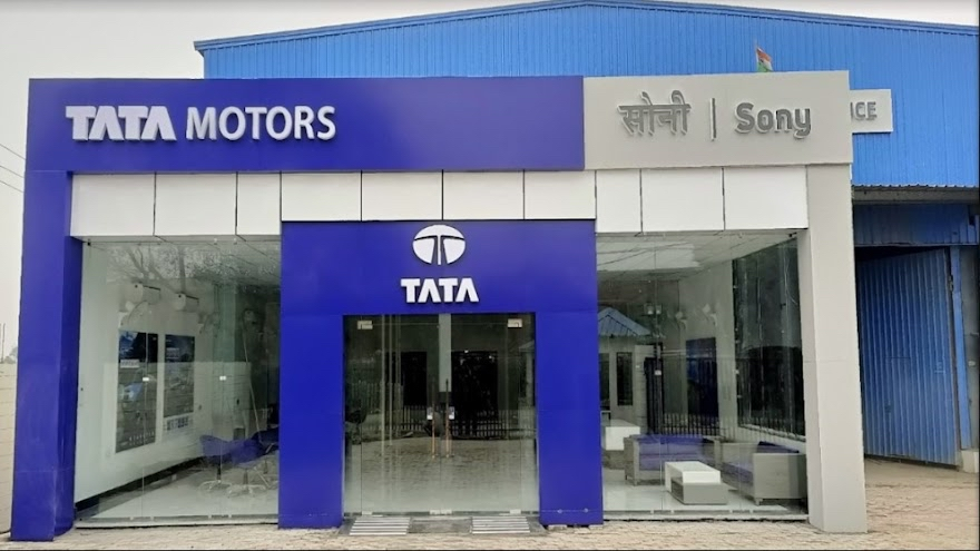 Technician working on a car engine at Sony Autos